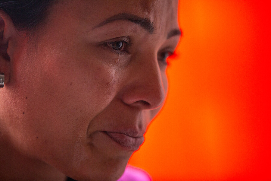 A close up of a woman crying
